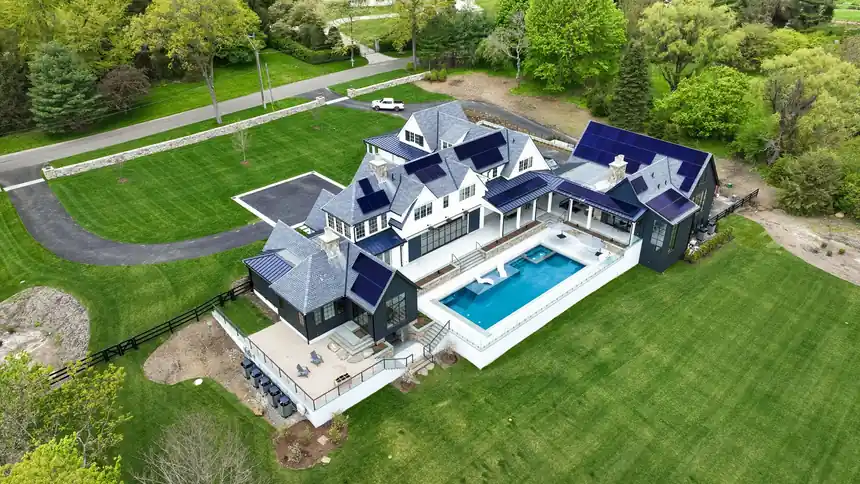 Aerial view of a house and its pool