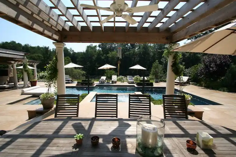 View through a pergola to a pool